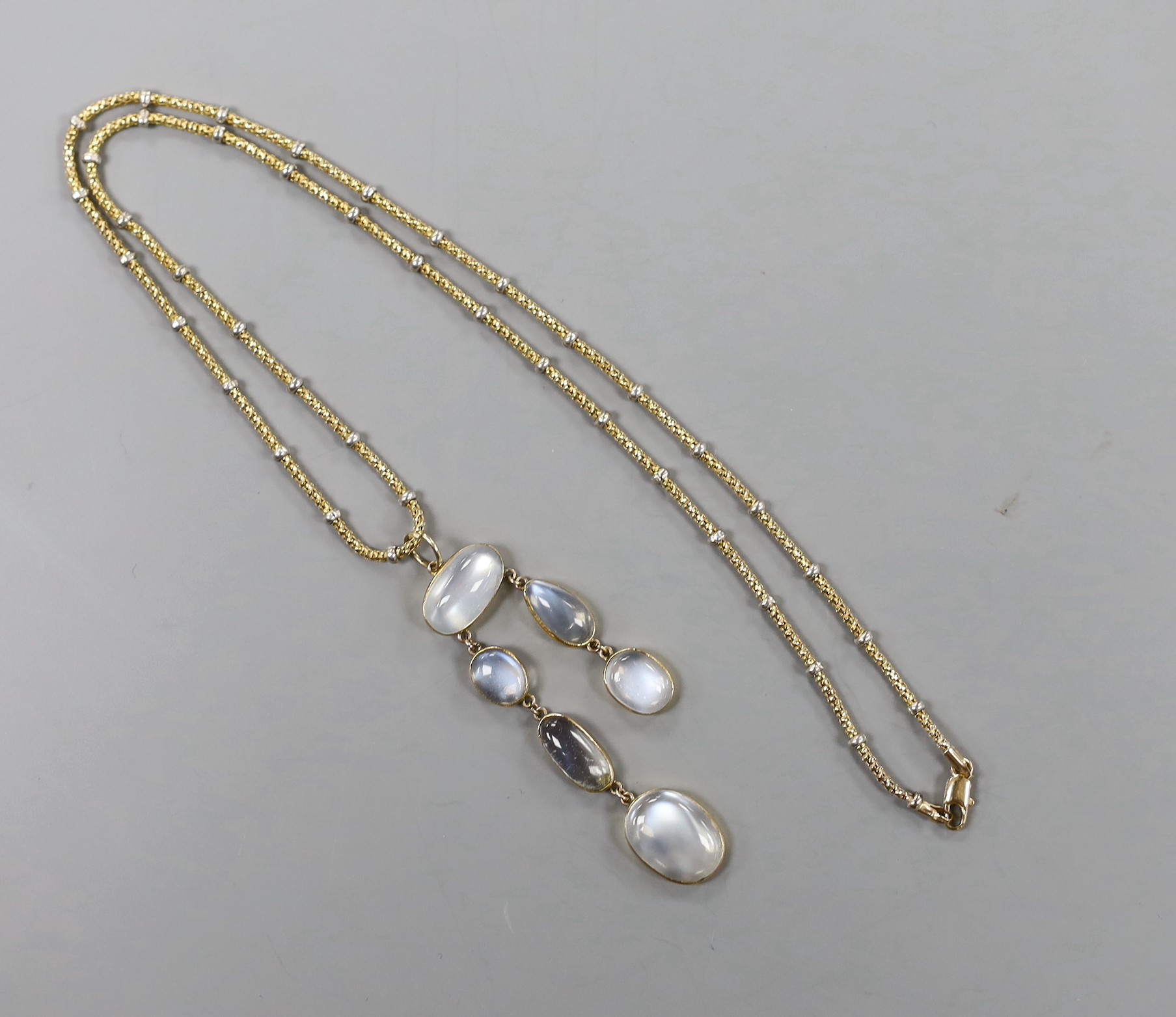 A 375 and six stone cabochon moonstone set drop necklace, with white metal spacers, approx. 60cm, gross weight 10.4 grams.